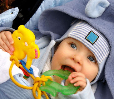 baby teething on toy