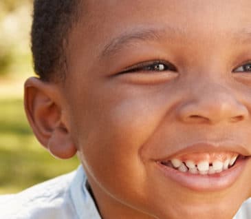Little Boy Smiling Outside