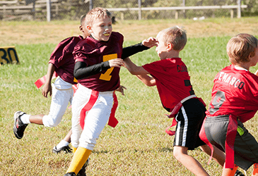 Kids playing sports with mouthguards