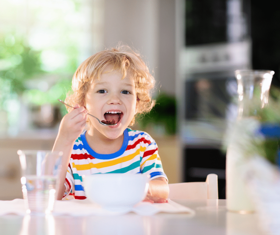 child eating breakfast
