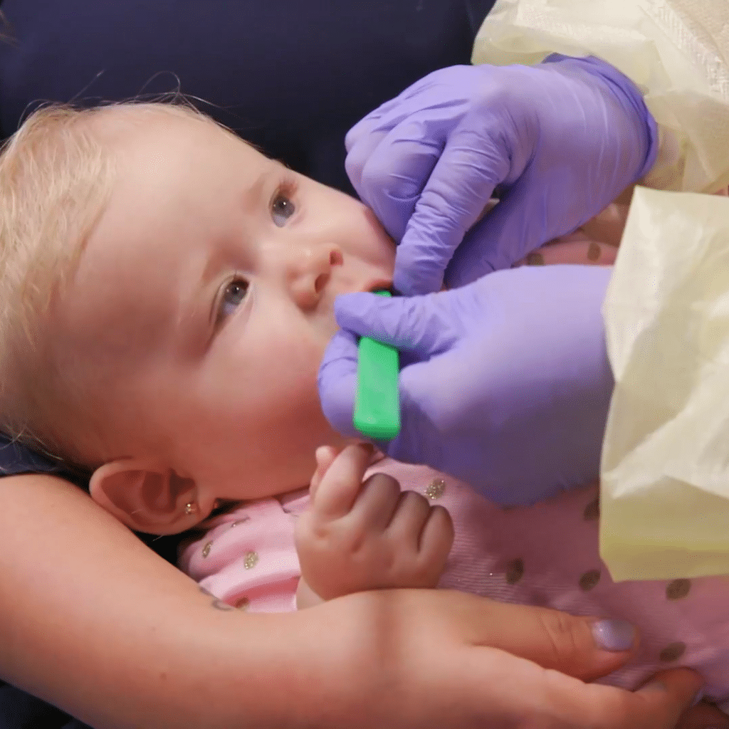 baby at first dental checkup