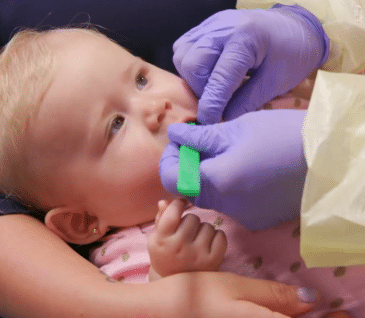 baby at first dental checkup